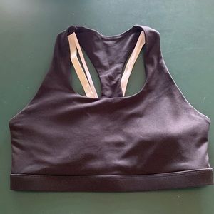 Fabletics black sports bra and matching Capri leggings